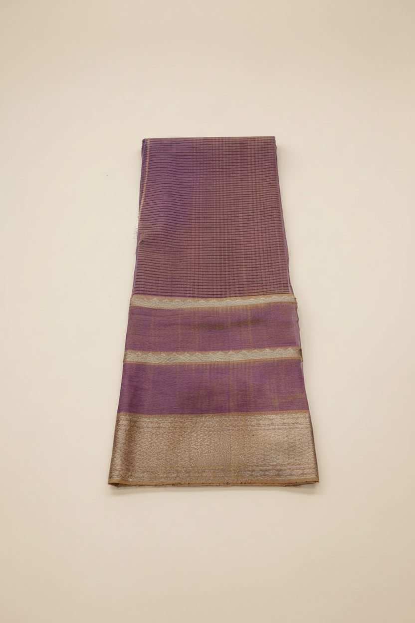 Purple fabric with gold border on a white background